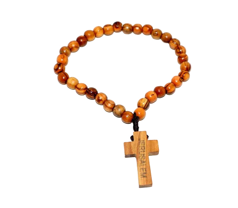 Wooden beaded bracelet with a cross pendant on a white background