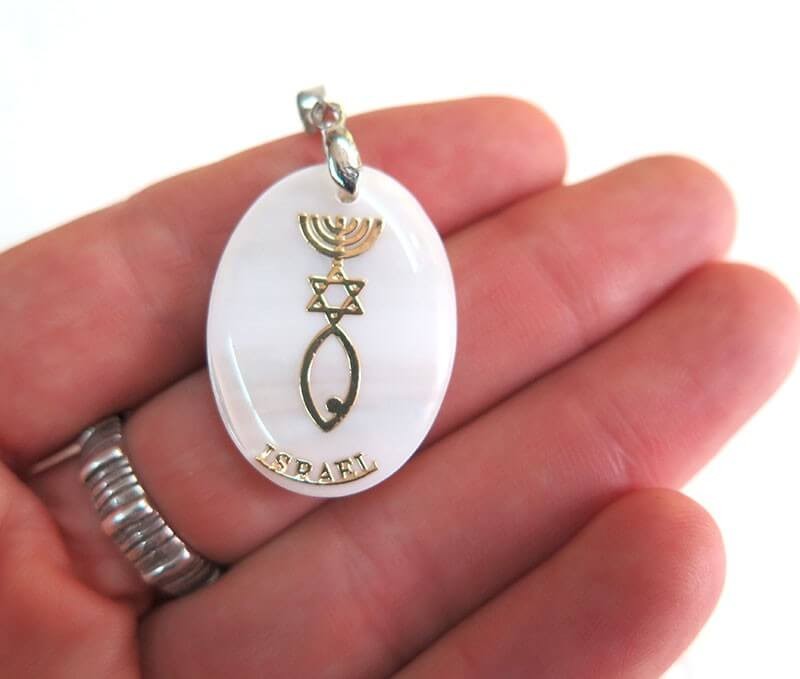 Mother of pearl pendant with with Grafted-in symbol