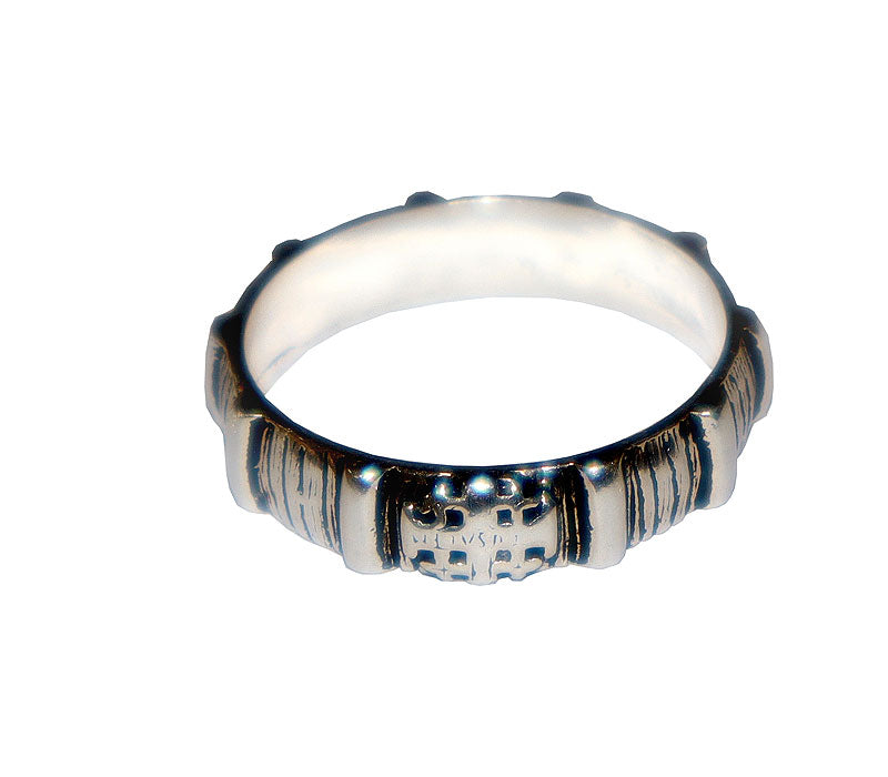 Silver rosary ring with a textured band on a white background