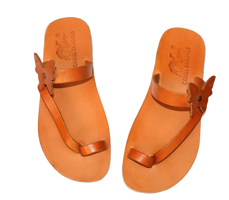 Pair of orange sandals with butterfly straps on a white background