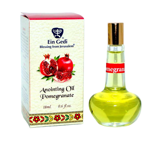 Anointing oil bottle with pomegranate design and Ein Gedi branding on a white background
