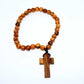 Wooden beaded bracelet with a cross pendant