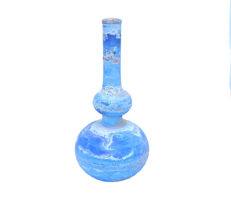 Blue glass vase with a textured surface on a white background