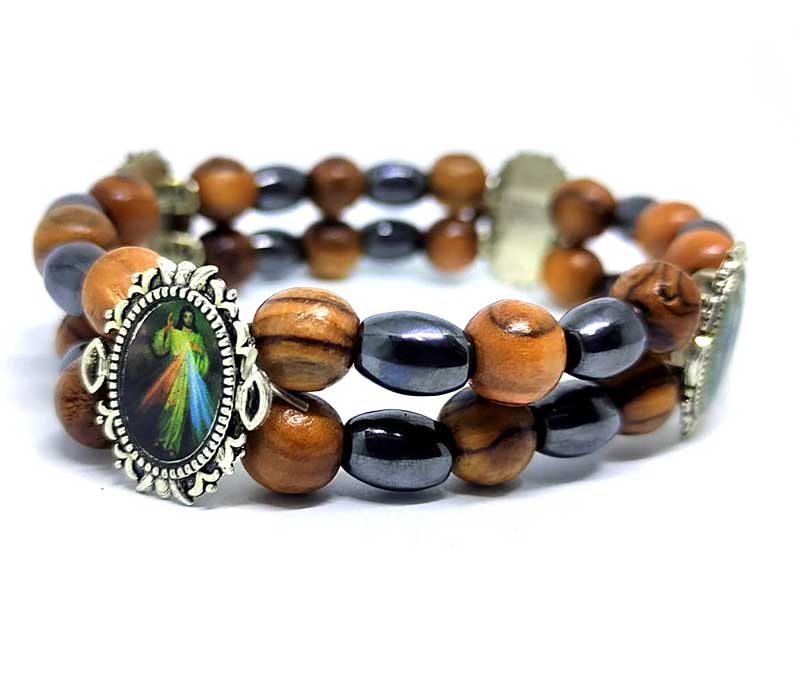 Multicolored beaded bracelet with a central focal point on a white background