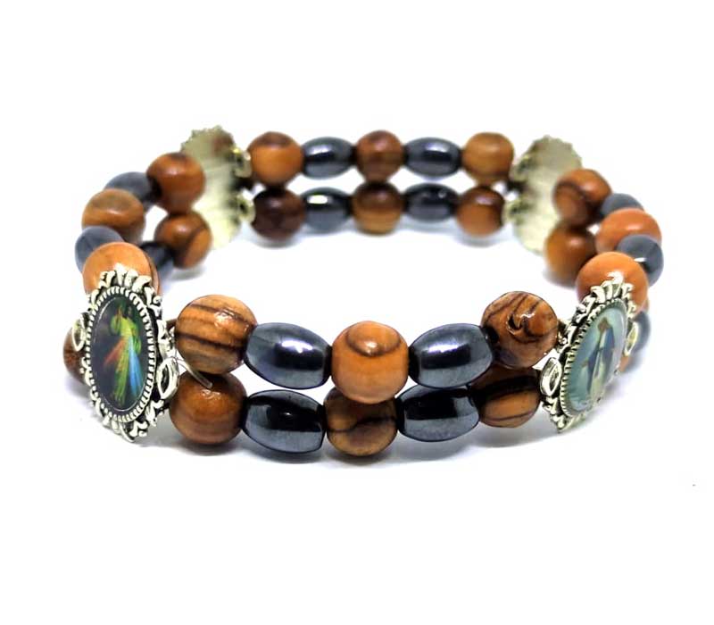 Multicolored beaded bracelet with decorative elements on a white background