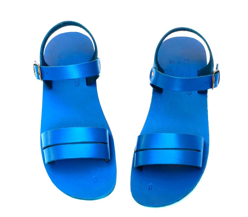 Pair of blue sandals on a white background
