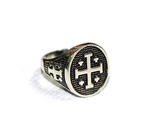 A silver ring featuring a Jerusalem cross design.