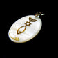 Mother of pearl pendant with with Grafted-in symbol